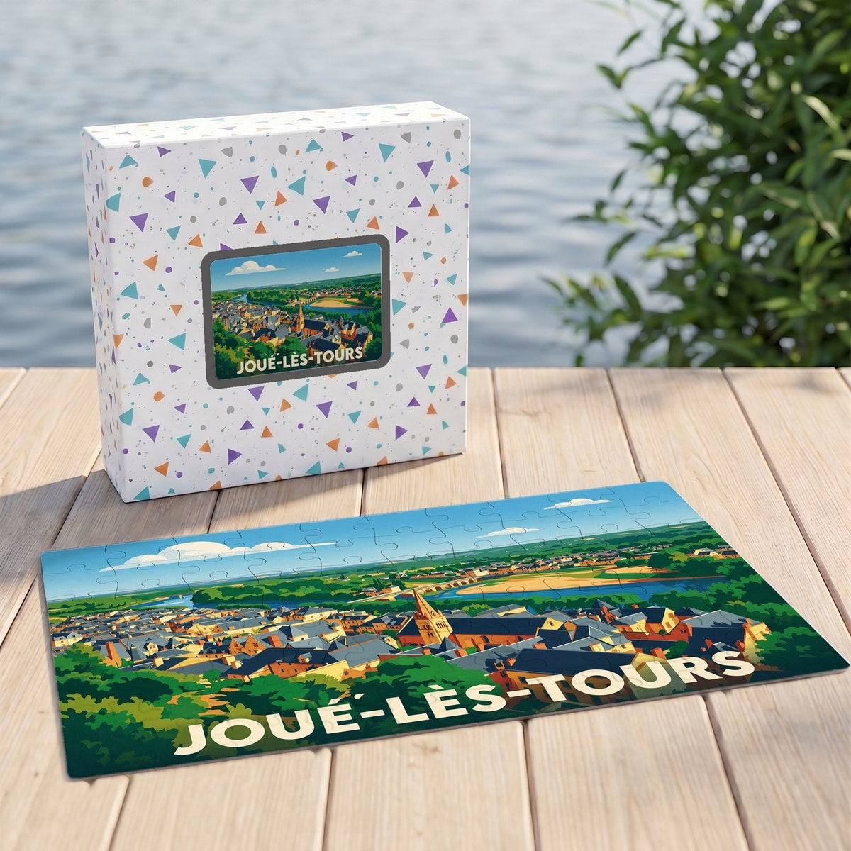 Puzzle souvenir de la ville de Joué-lès-Tours avec une illustration stylisée et colorée.