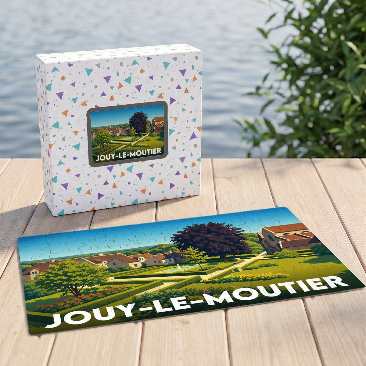 Puzzle souvenir de la ville de Jouy-le-Moutier avec une illustration stylisée d'un paysage urbain verdoyant.