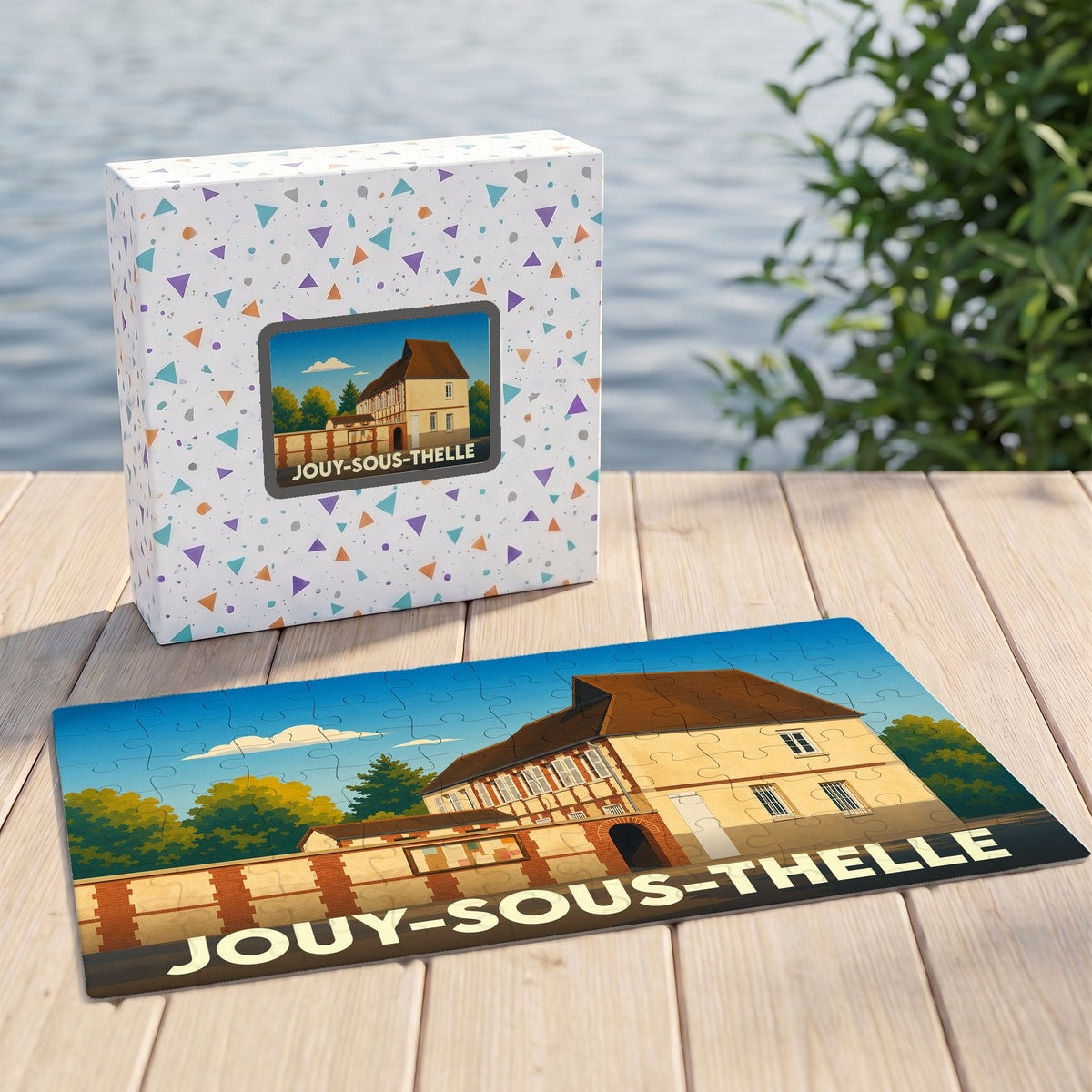 Puzzle souvenir de la ville de Jouy-sous-Thelle avec une illustration stylisée d'un bâtiment historique.