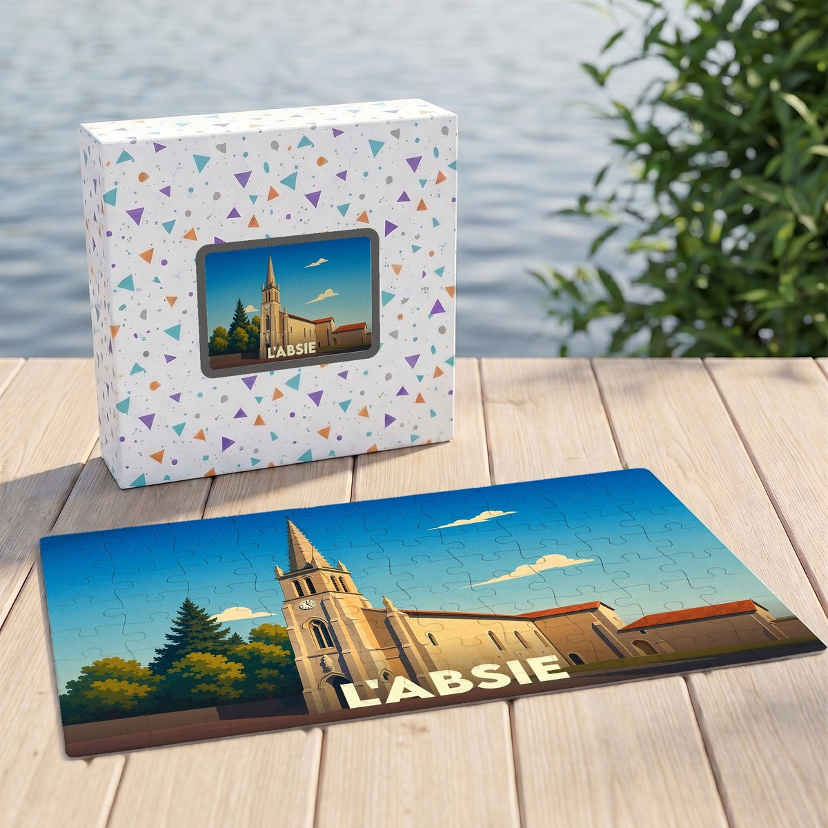 Puzzle souvenir de la ville de L'Absie avec une illustration stylisée d'une église.