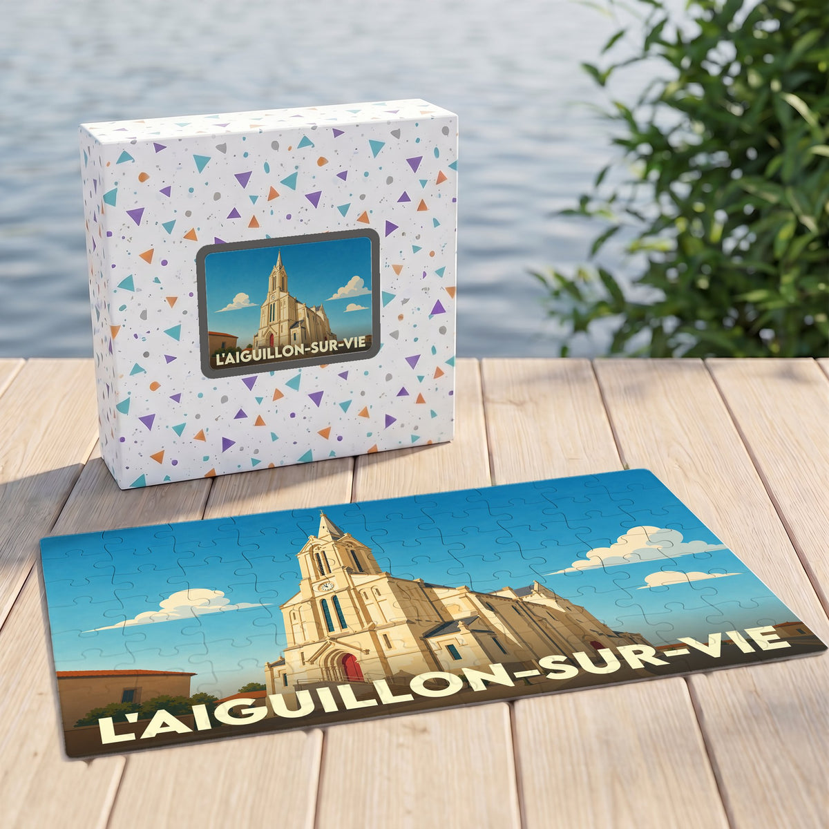 Puzzle souvenir de la ville de L'Aiguillon-sur-Vie avec une illustration stylisée de son église.