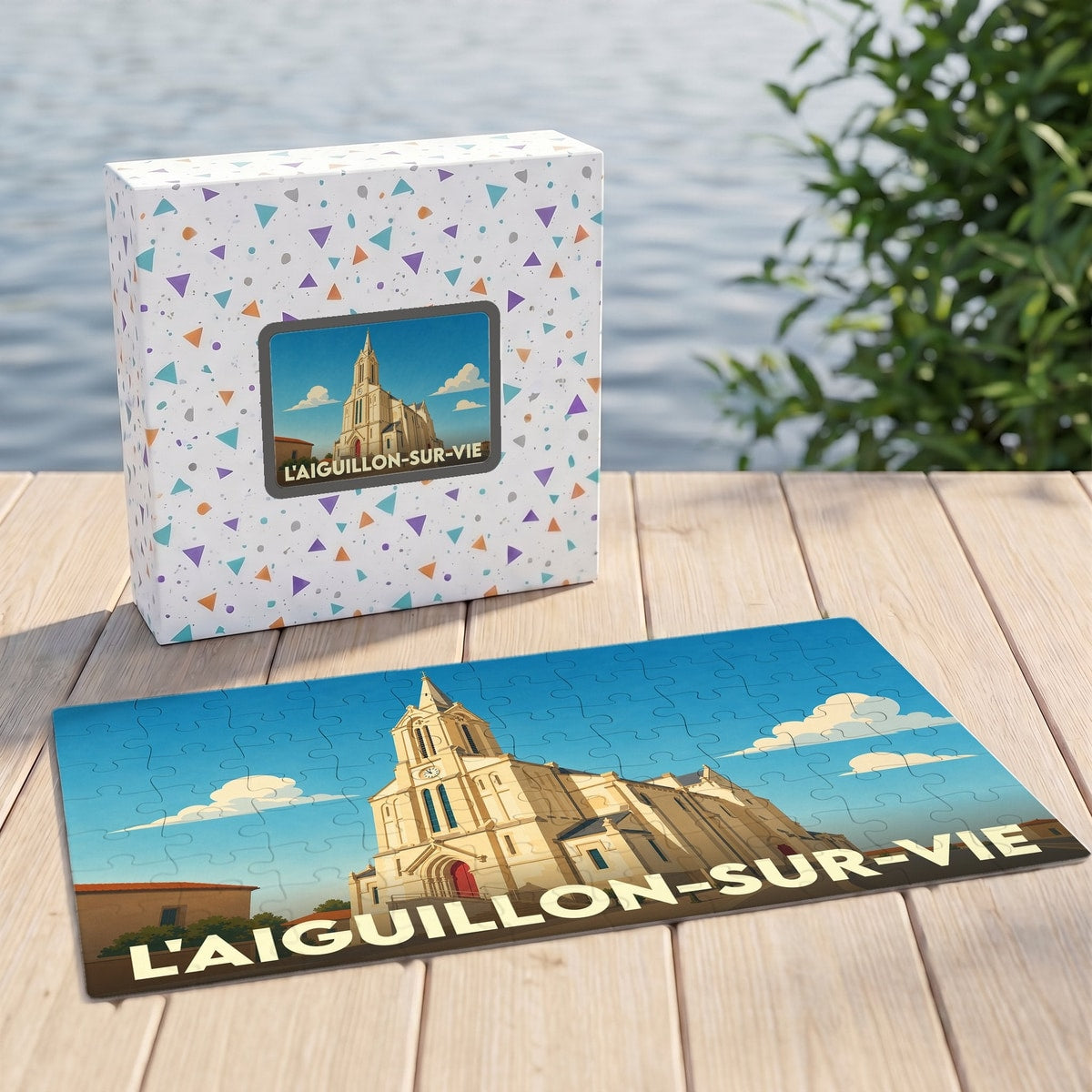 Puzzle souvenir de la ville de L'Aiguillon-sur-Vie avec une illustration stylisée de son église.