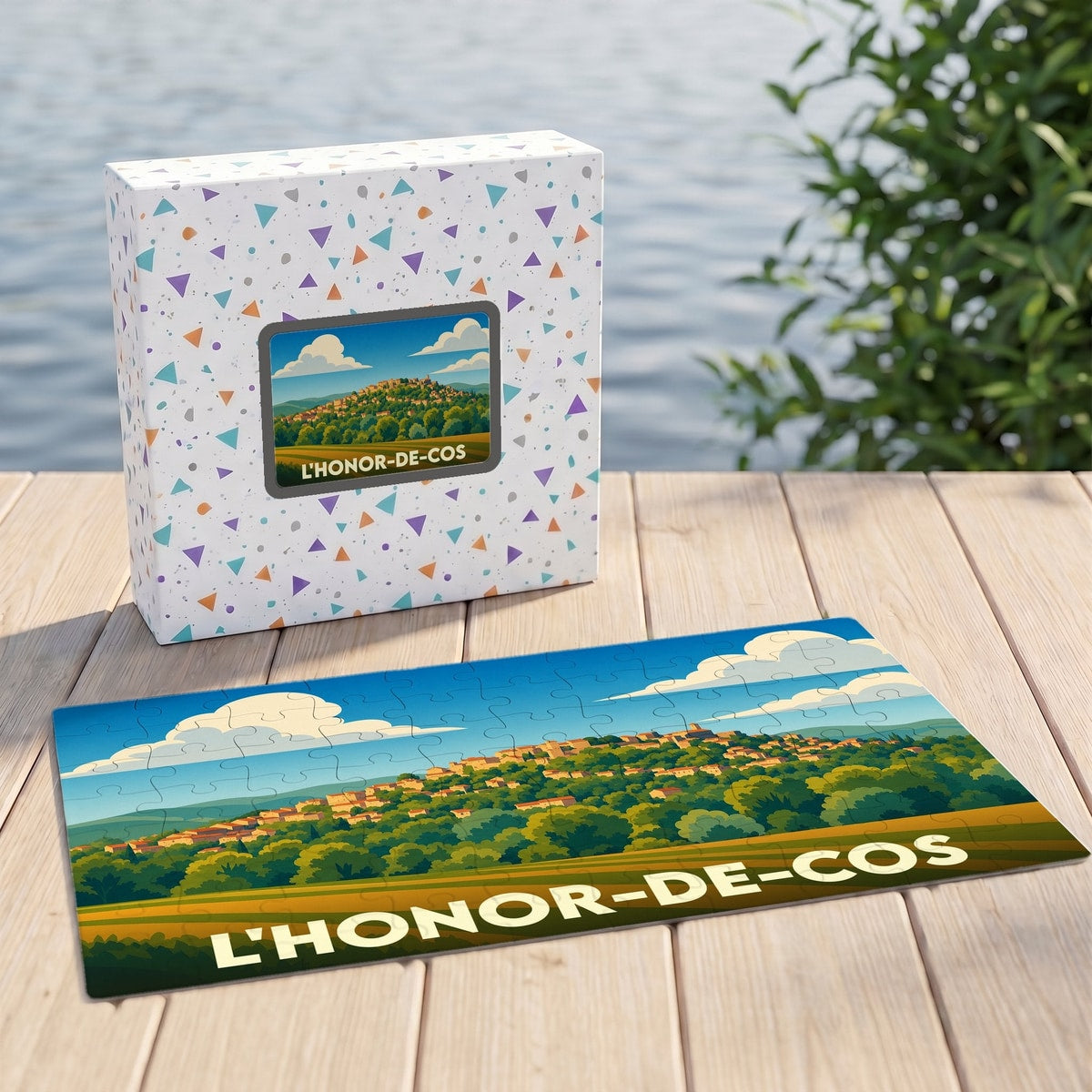 Puzzle souvenir de la ville de L'Honor-de-Cos avec une illustration stylisée de son paysage vallonné.