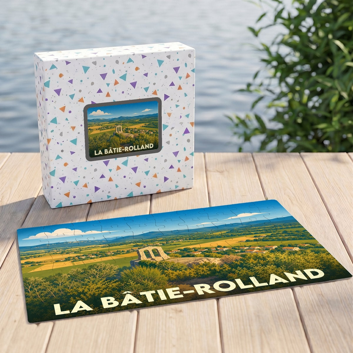 Puzzle souvenir de la ville de La Bâtie-Rolland avec une illustration de paysage champêtre.