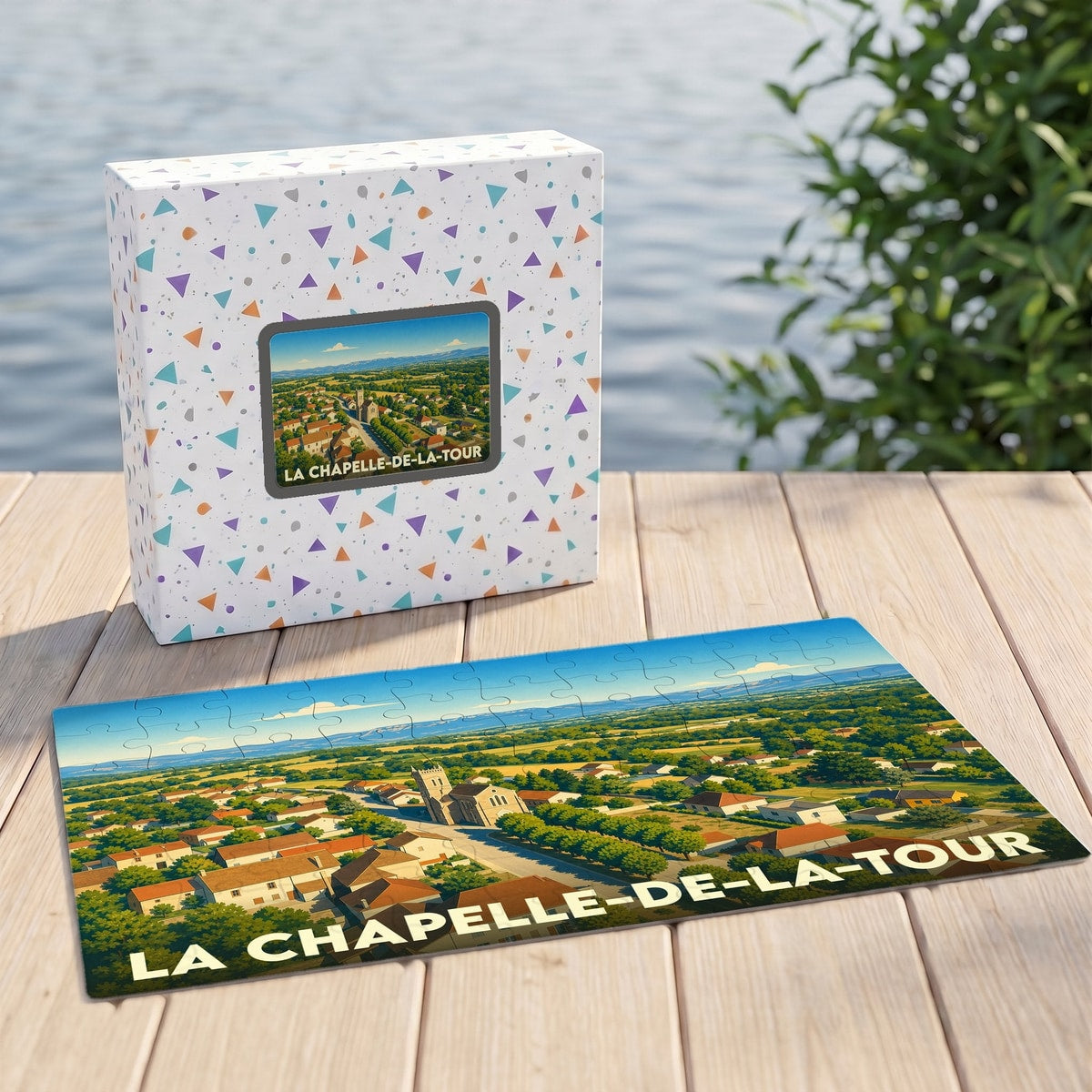 Puzzle souvenir de la commune de La Chapelle-de-la-Tour avec une illustration paysagère du village.