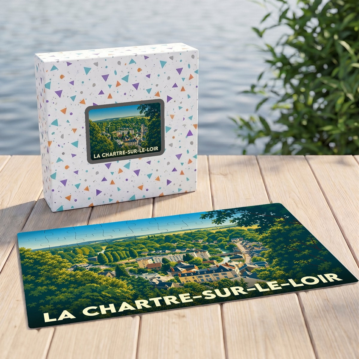 Puzzle souvenir de la ville de La Chartre-sur-le-Loir avec une illustration paysagère stylisée.