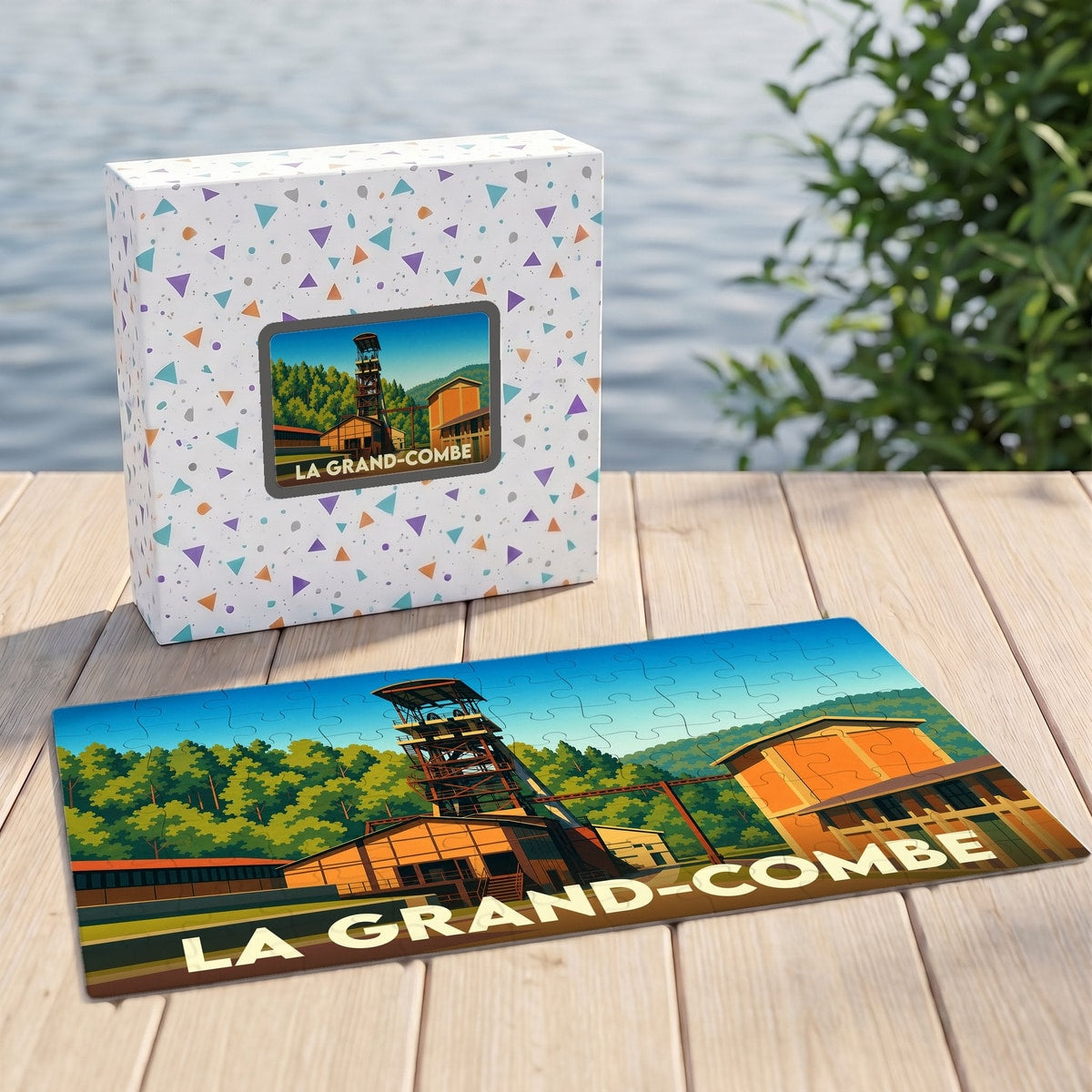 Puzzle souvenir de la ville de La Grand-Combe avec une illustration stylisée d'un ancien site minier.