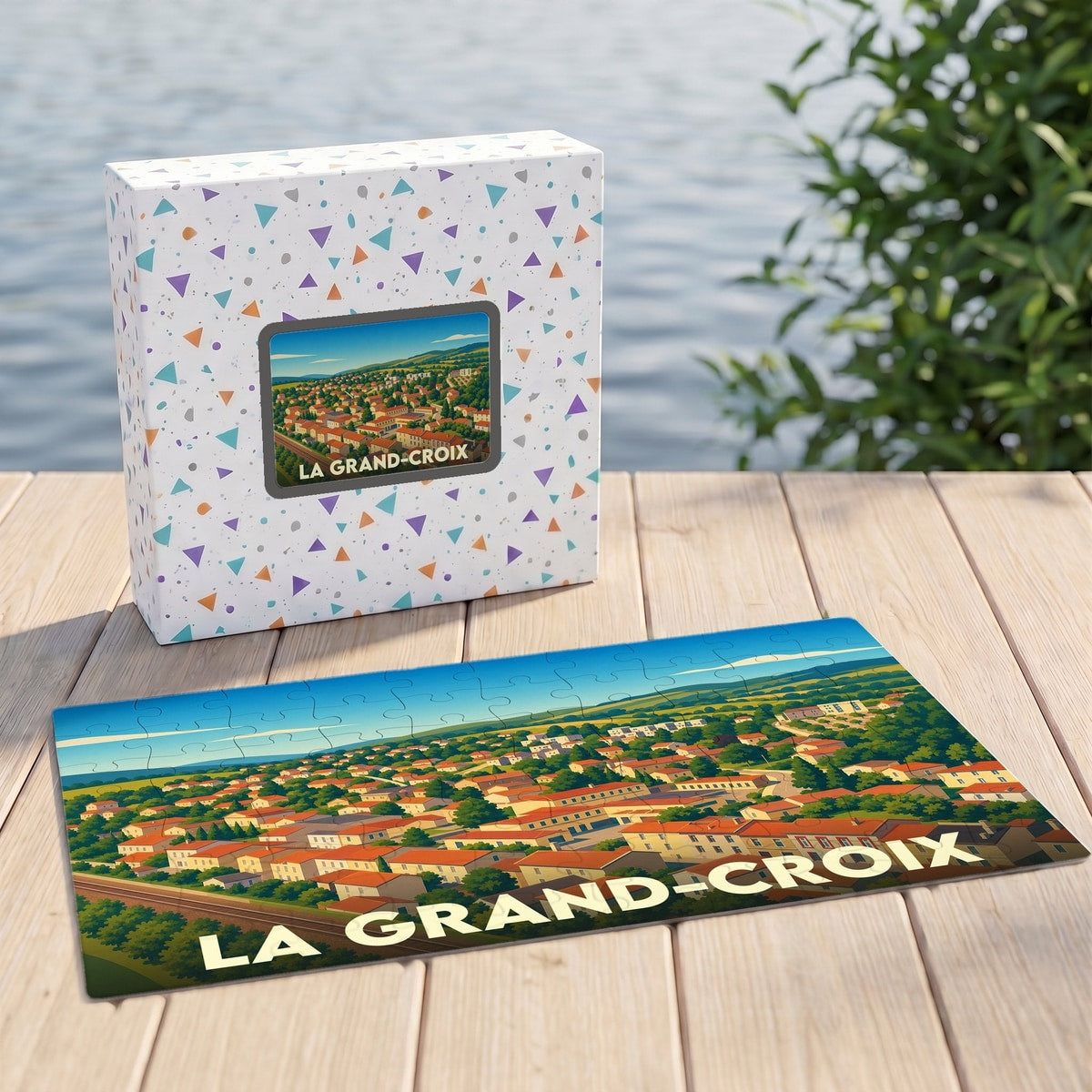 Puzzle souvenir de la ville de La Grand-Croix avec une illustration panoramique stylisée.
