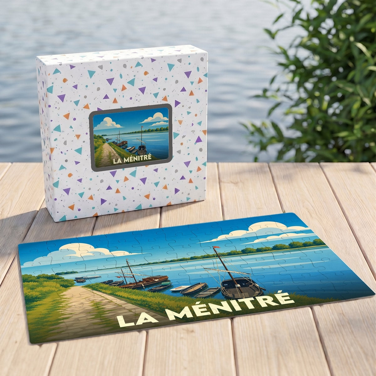 Puzzle souvenir de la ville de La Ménitré illustrant des bateaux traditionnels sur la Loire.