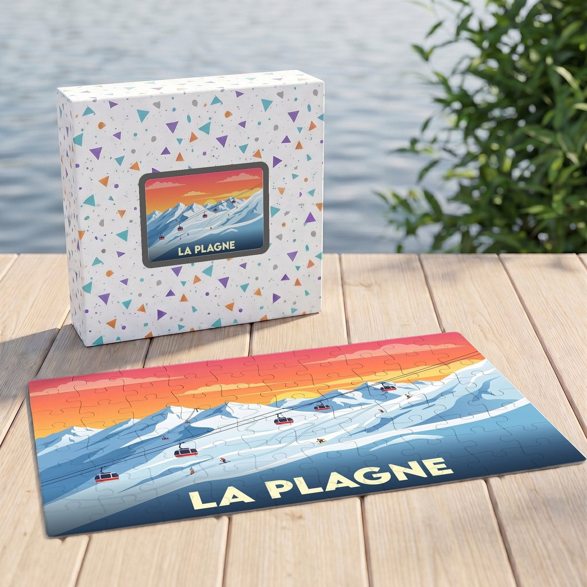 Puzzle souvenir de la station de La Plagne présentant une illustration stylisée de montagnes enneigées et de téléphériques au coucher du soleil.