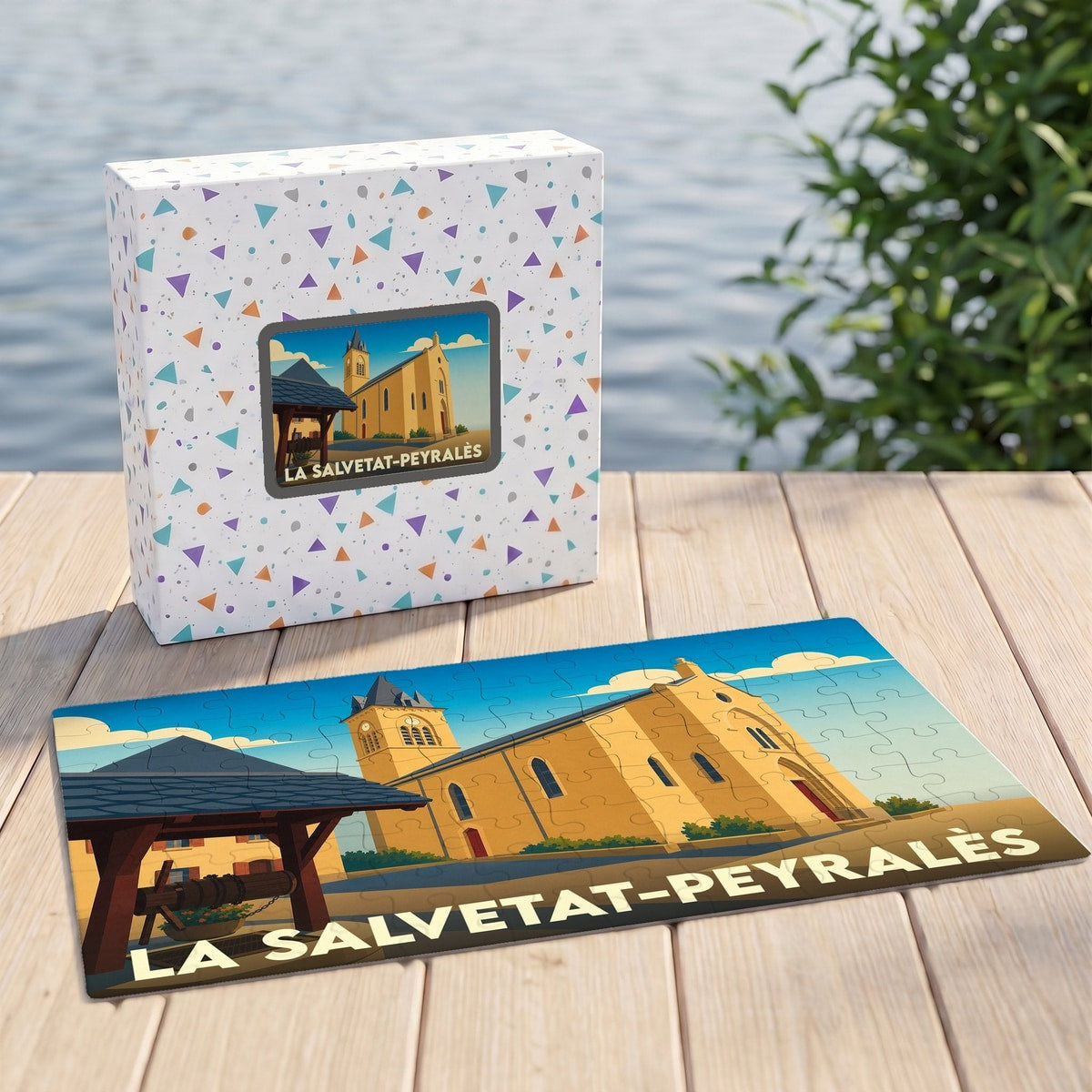 Puzzle souvenir de la ville de La Salvetat-Peyralès avec une illustration stylisée de son église et de son puits.