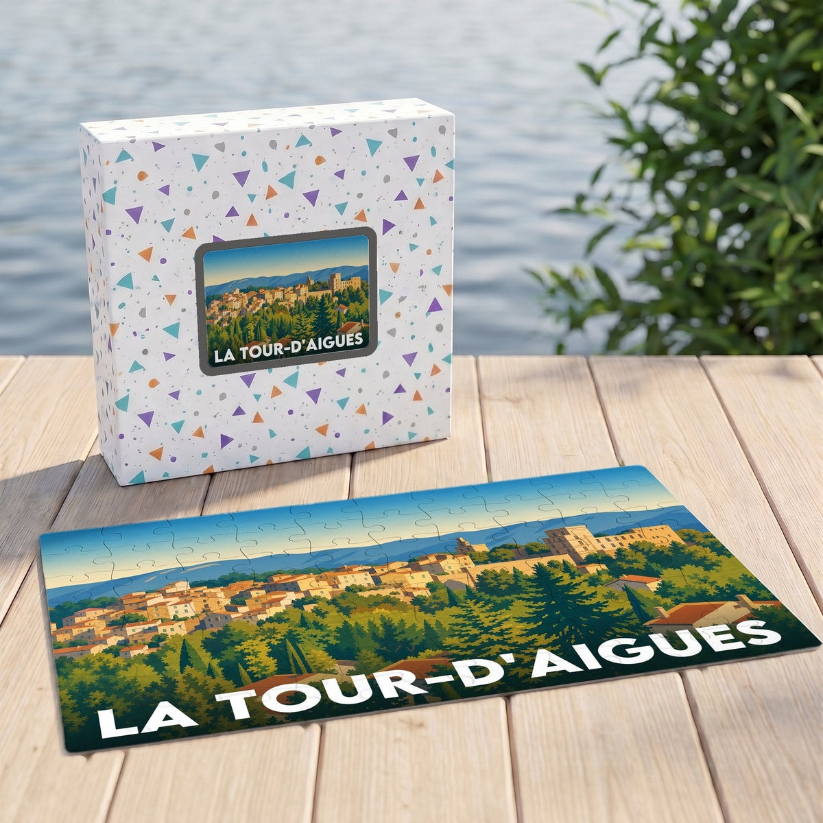 Puzzle souvenir de la ville de La Tour-d'Aigues avec une illustration panoramique stylisée.