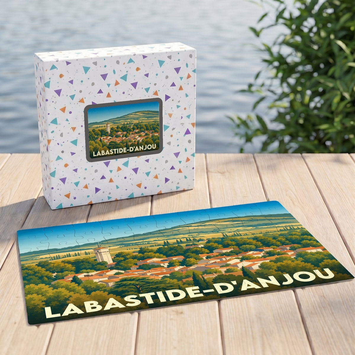 Puzzle souvenir de la ville de Labastide-d'Anjou avec une illustration panoramique stylisée.