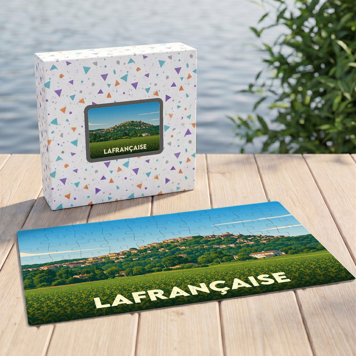 Puzzle souvenir de la ville de Lafrançaise représentant un paysage vallonné avec une illustration stylisée.