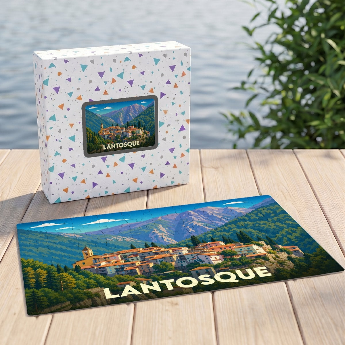 Puzzle souvenir de la ville de Lantosque avec une illustration stylisée d'un village de montagne.