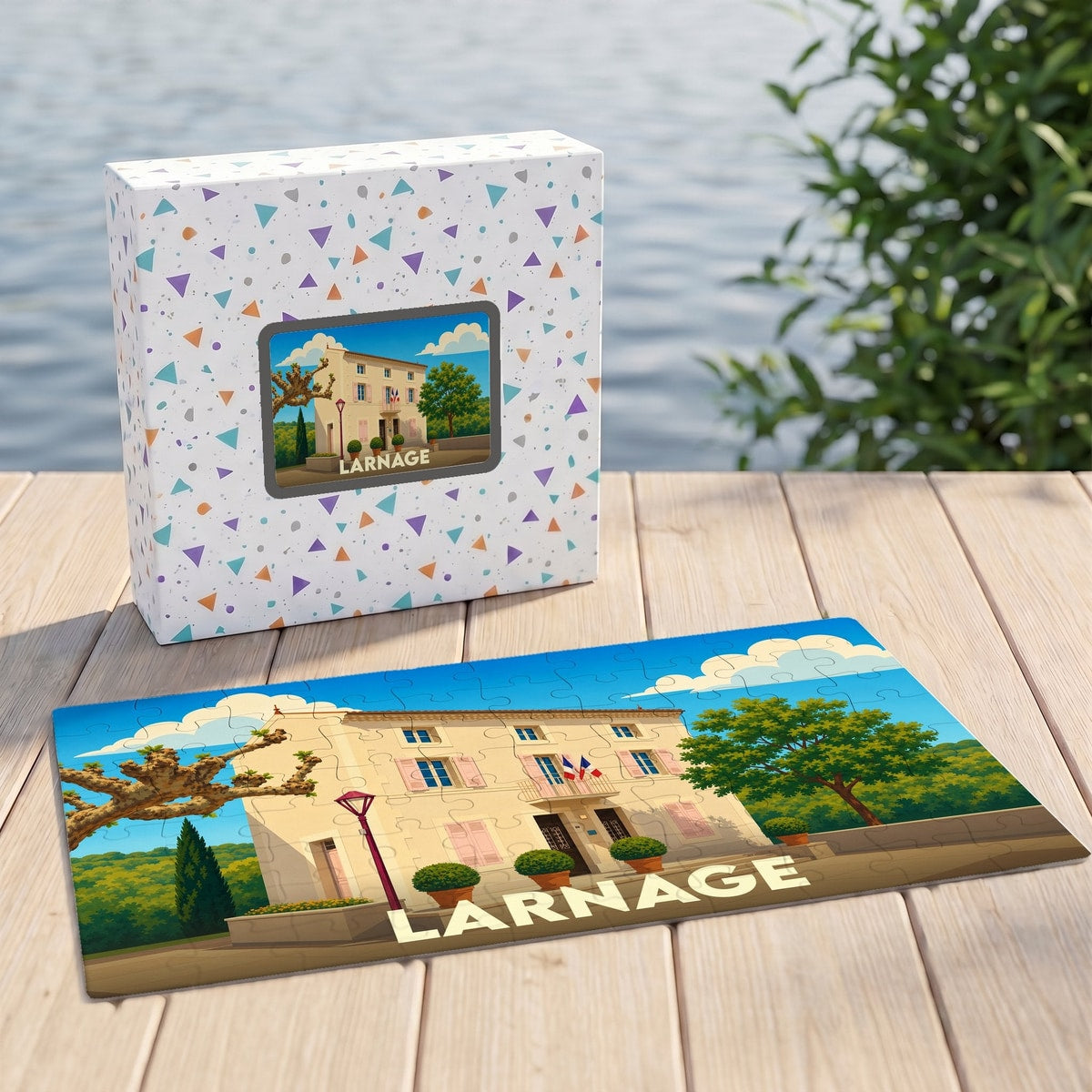 Puzzle souvenir de la ville de Larnage avec une illustration stylisée d'un bâtiment provençal.