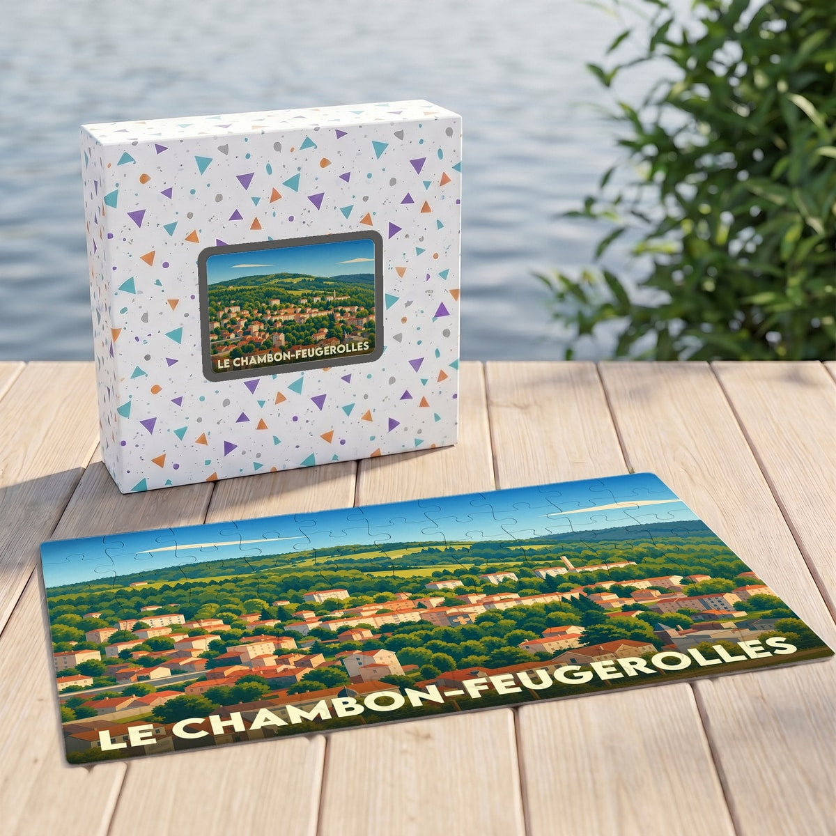 Puzzle souvenir de la ville de Le Chambon-Feugerolles avec une illustration panoramique stylisée.