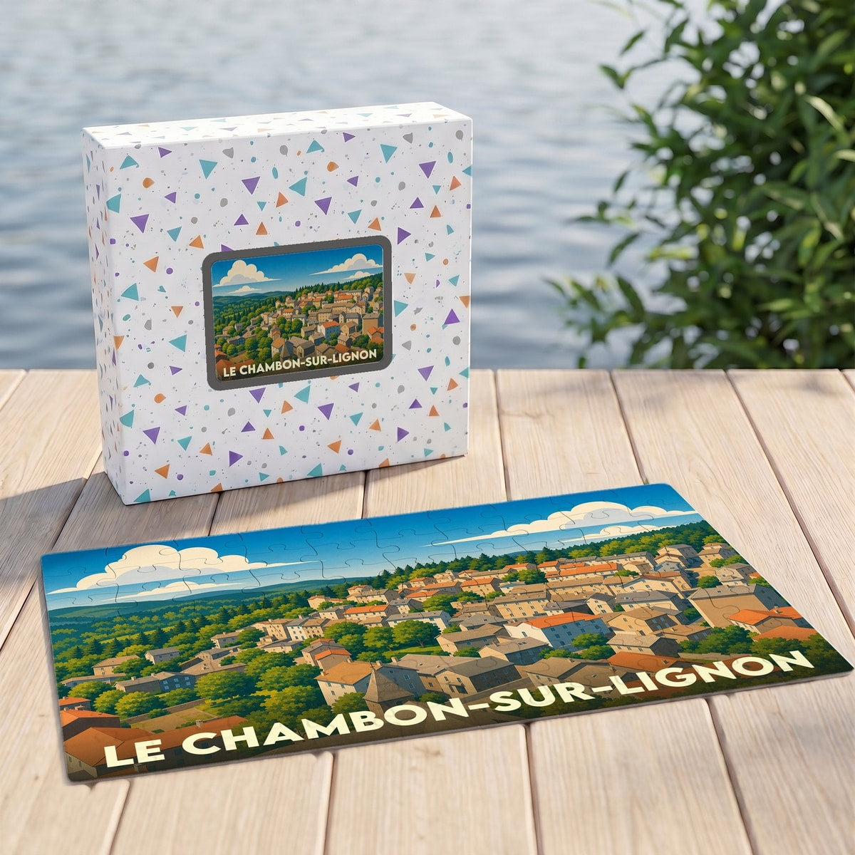Puzzle souvenir de la ville du Chambon-sur-Lignon avec une illustration stylisée d'un village ensoleillé.