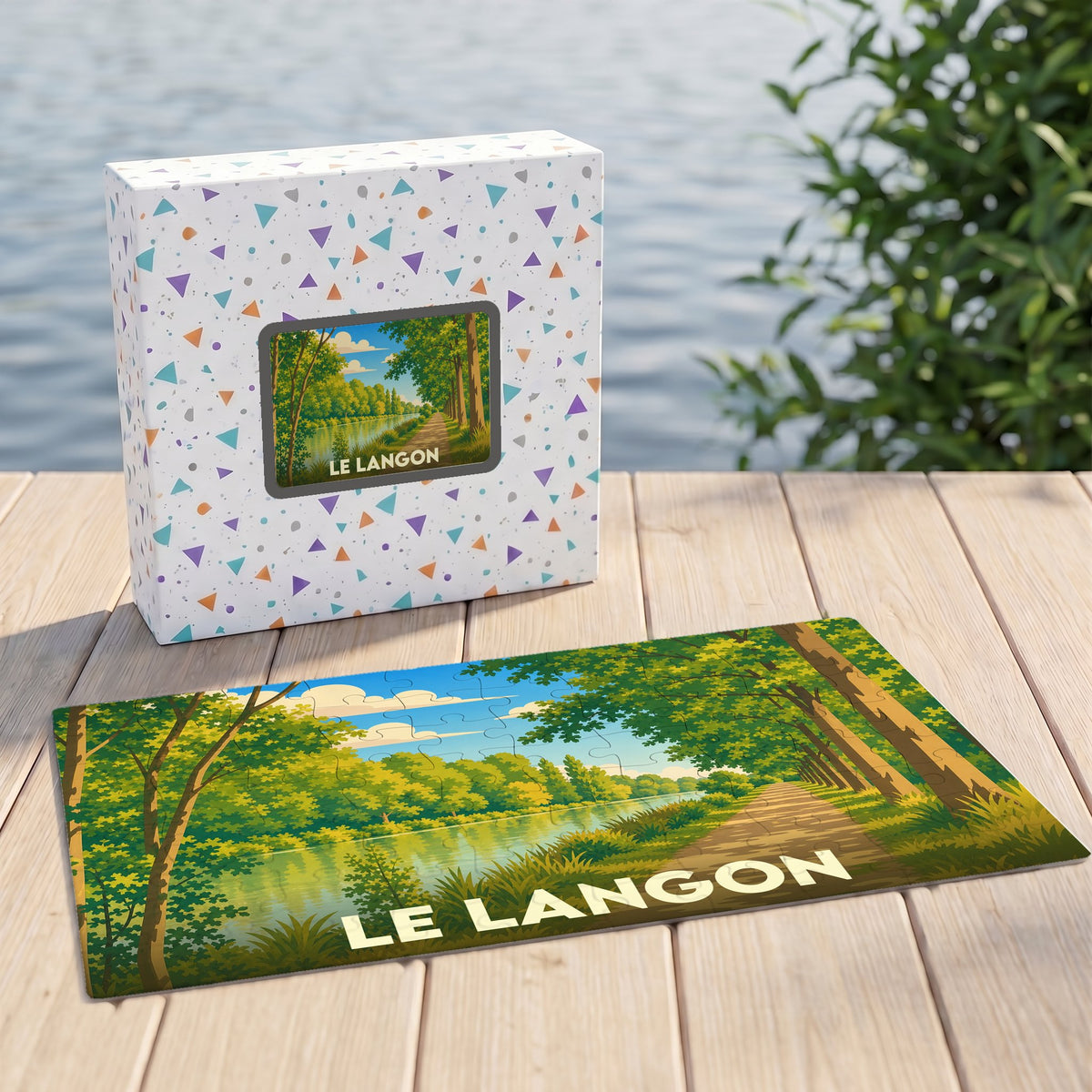 Puzzle souvenir de la ville de Le Langon avec une illustration de paysage arboré au bord de l'eau.