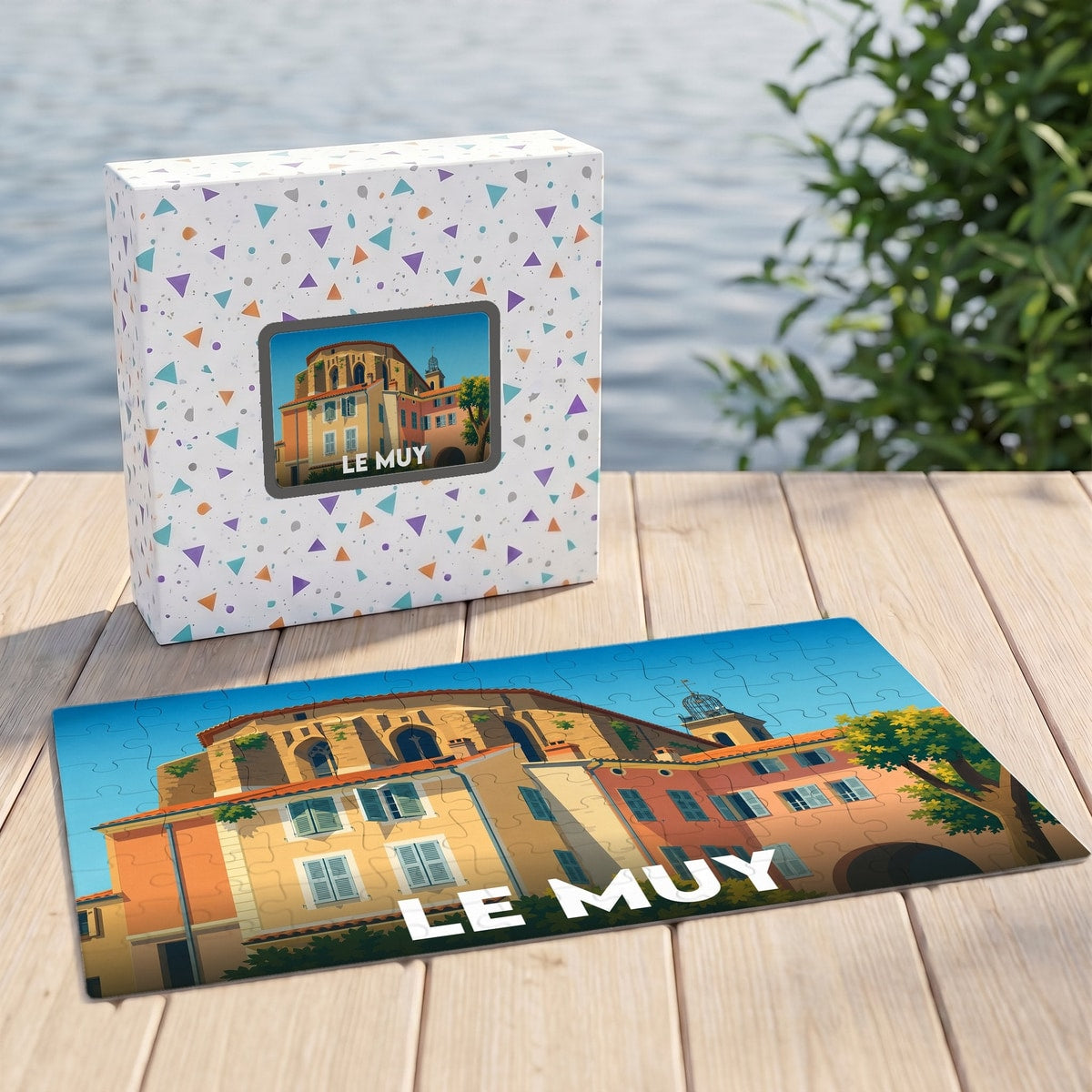 Puzzle souvenir de la ville de Le Muy illustré d'un paysage urbain stylisé, présenté avec sa boîte assortie.