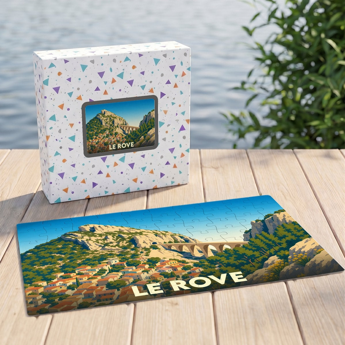 Puzzle souvenir de la ville de Le Rove avec une illustration stylisée d'un viaduc et d'un village provençal.