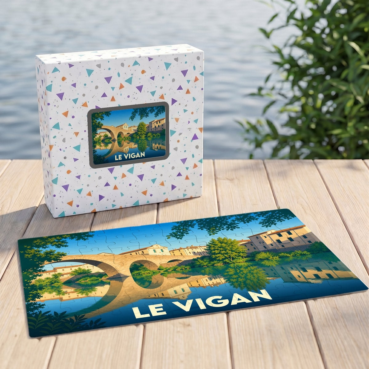 Puzzle souvenir de la ville de Le Vigan avec une illustration stylisée d'un pont se reflétant dans l'eau.