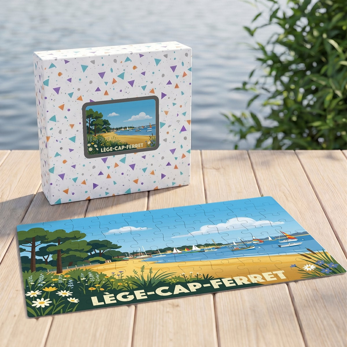 Puzzle souvenir de la ville de Lège-Cap-Ferret avec une illustration stylisée du littoral et sa boîte assortie.