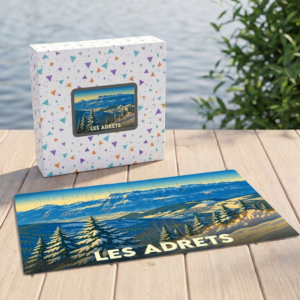 Puzzle souvenir de la ville de Les Adrets avec une illustration de paysage montagneux enneigé.