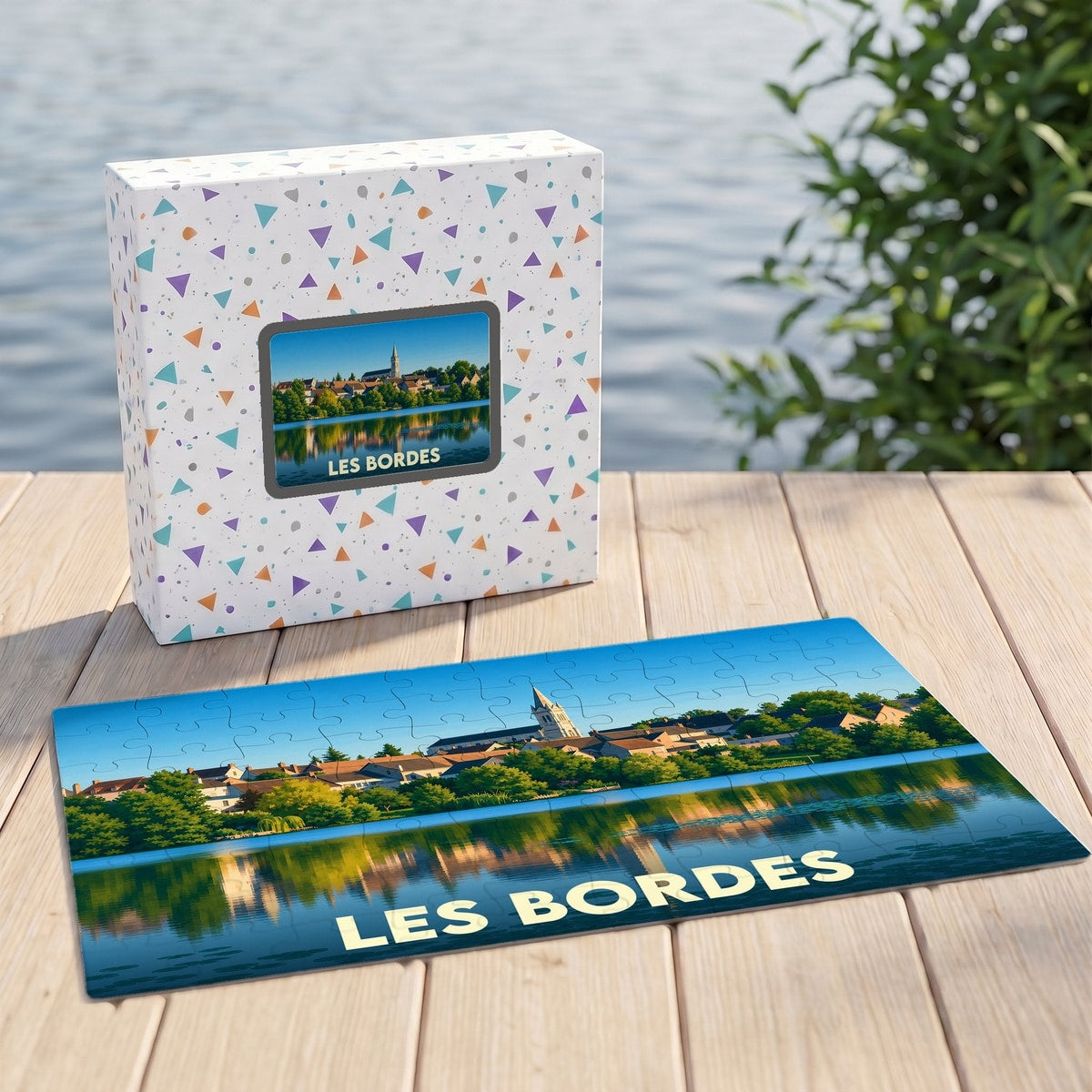 Puzzle souvenir de la ville de Les Bordes représentant un paysage avec son église se reflétant dans l'eau.