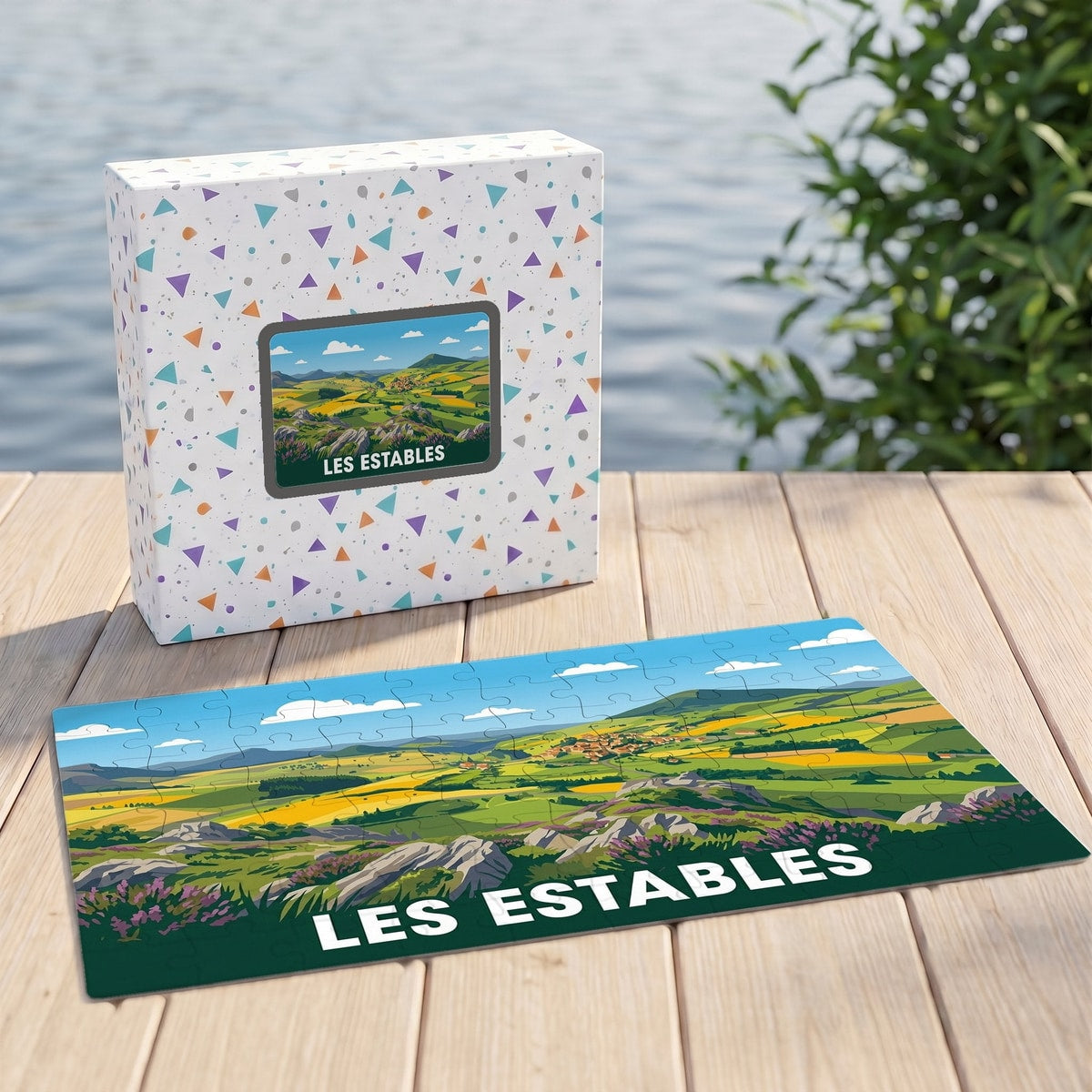 Puzzle souvenir de la ville de Les Estables avec une illustration stylisée de paysages vallonnés.