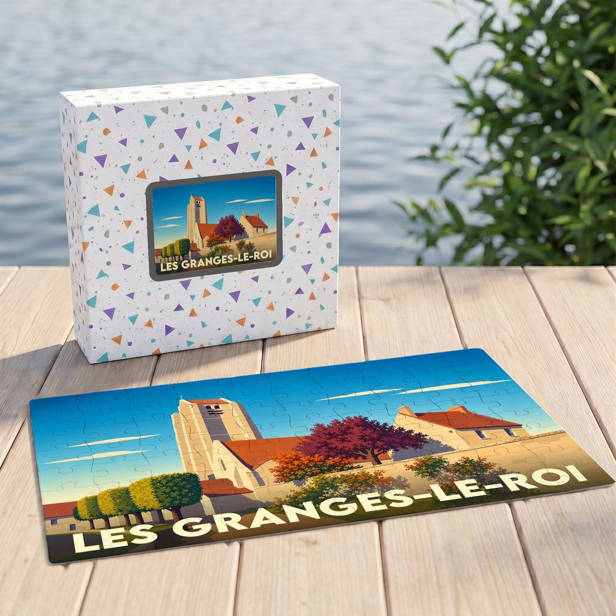 Puzzle souvenir de la ville de Les Granges-le-Roi avec une illustration stylisée d'une église et son emballage assorti.