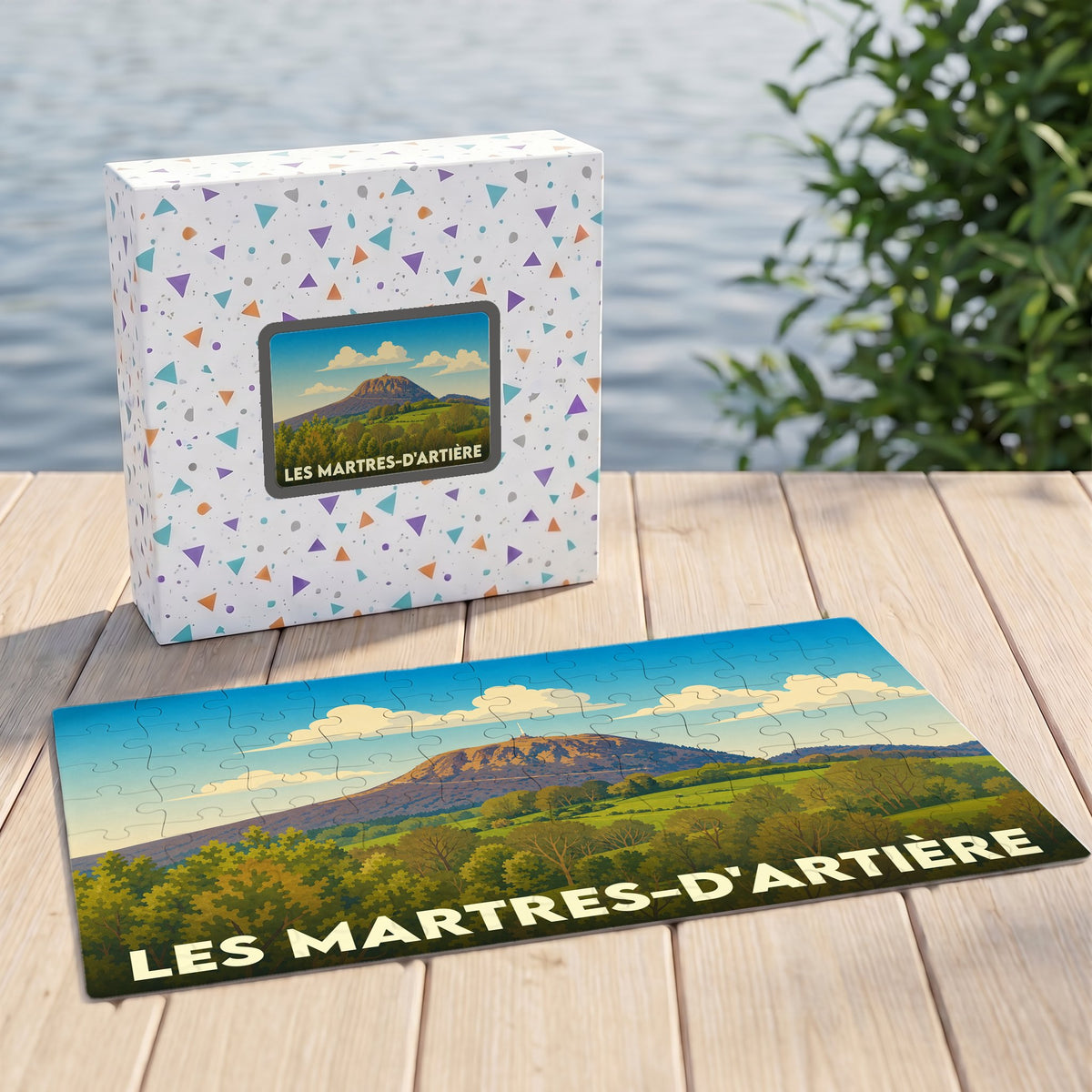Puzzle souvenir de la ville de Les Martres-d'Artière avec une illustration stylisée d'un paysage de montagne.