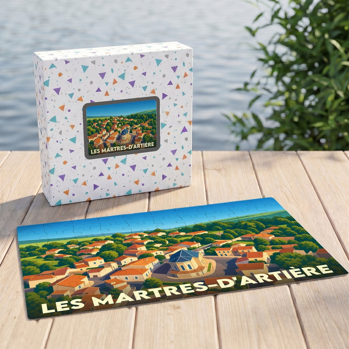 Puzzle souvenir de la ville de Les Martres-d'Artière avec une illustration stylisée d'une vue aérienne.