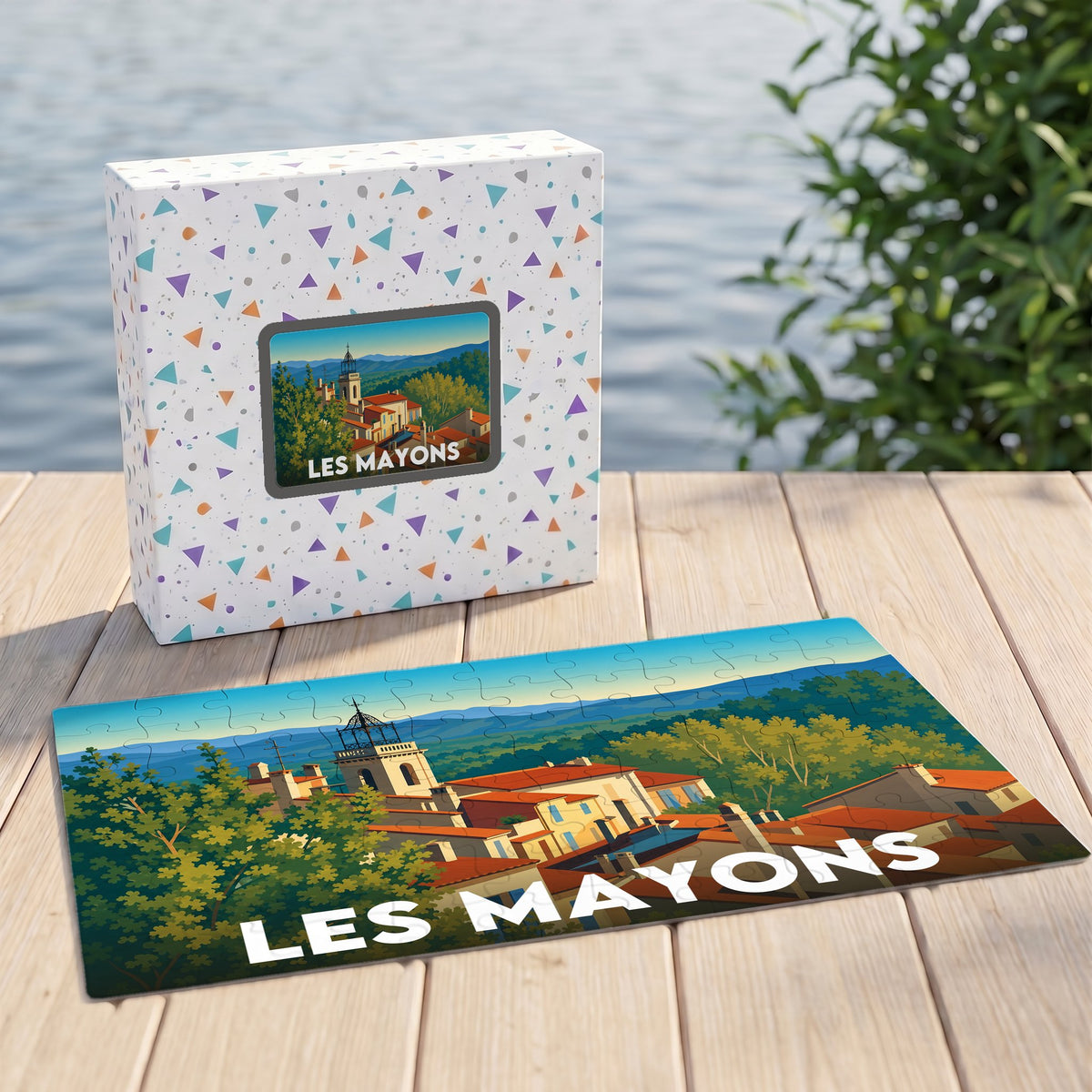 Puzzle souvenir de la ville de Les Mayons avec une illustration stylisée et colorée.