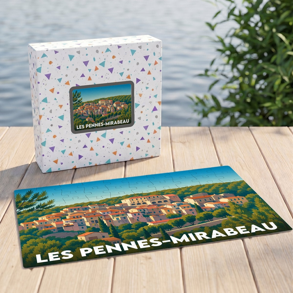 Puzzle souvenir de la ville de Les Pennes-Mirabeau avec une illustration stylisée d'un village provençal.