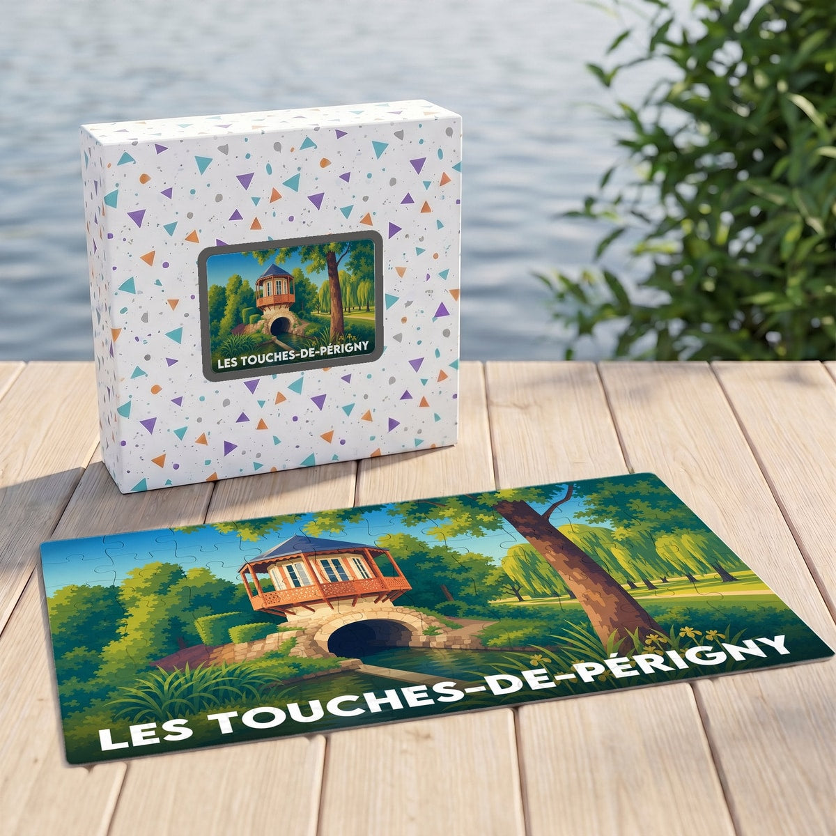 Puzzle souvenir de la ville de Les Touches-de-Périgny avec une illustration stylisée d'un pavillon au bord de l'eau.