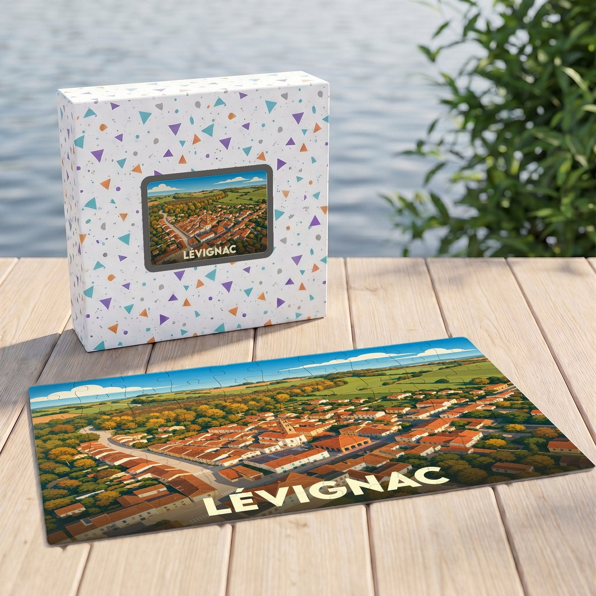 Puzzle souvenir de la ville de Lévignac avec une illustration stylisée d'une vue aérienne.
