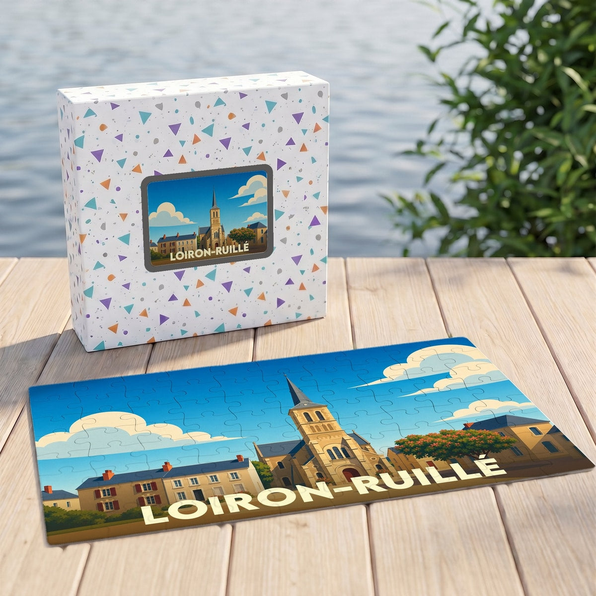 Puzzle souvenir de la ville de Loiron-Ruillé avec une illustration stylisée d'une église sous un ciel bleu.