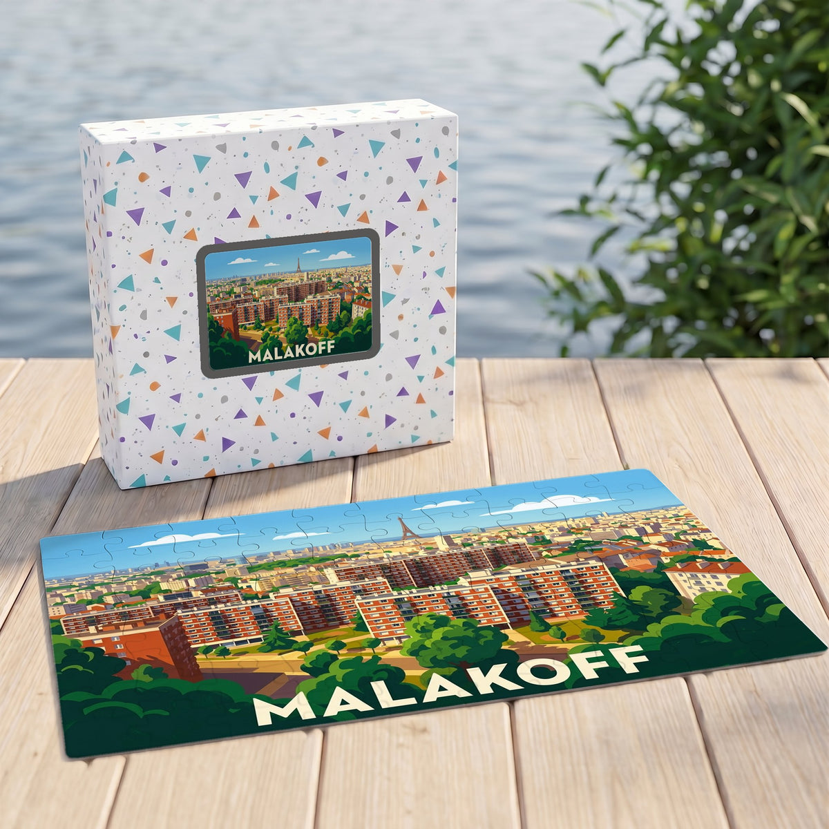 Puzzle souvenir de la ville de Malakoff avec une illustration panoramique stylisée.