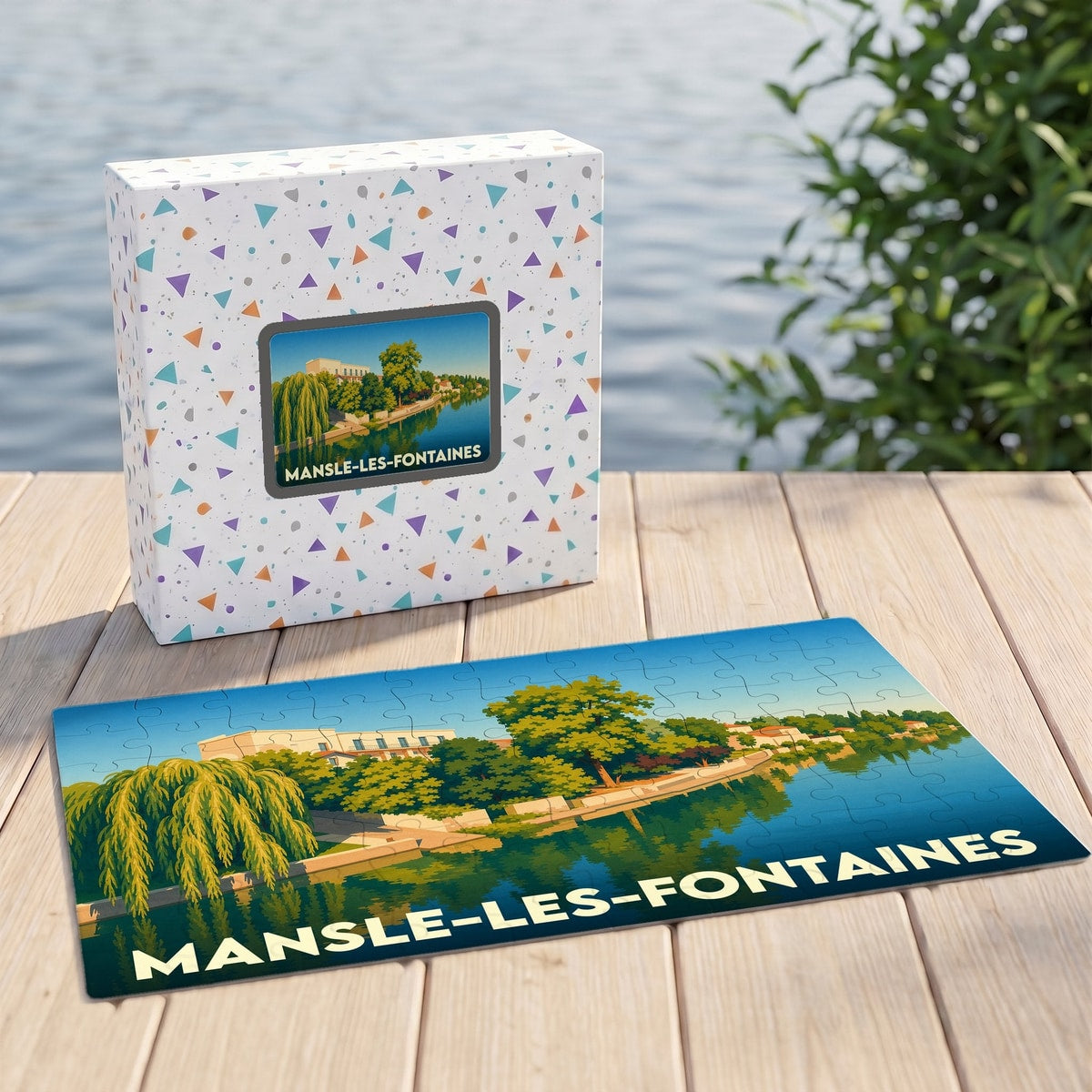 Puzzle souvenir de la ville de Mansle-les-Fontaines avec une illustration stylisée d'un paysage de bord d'eau.