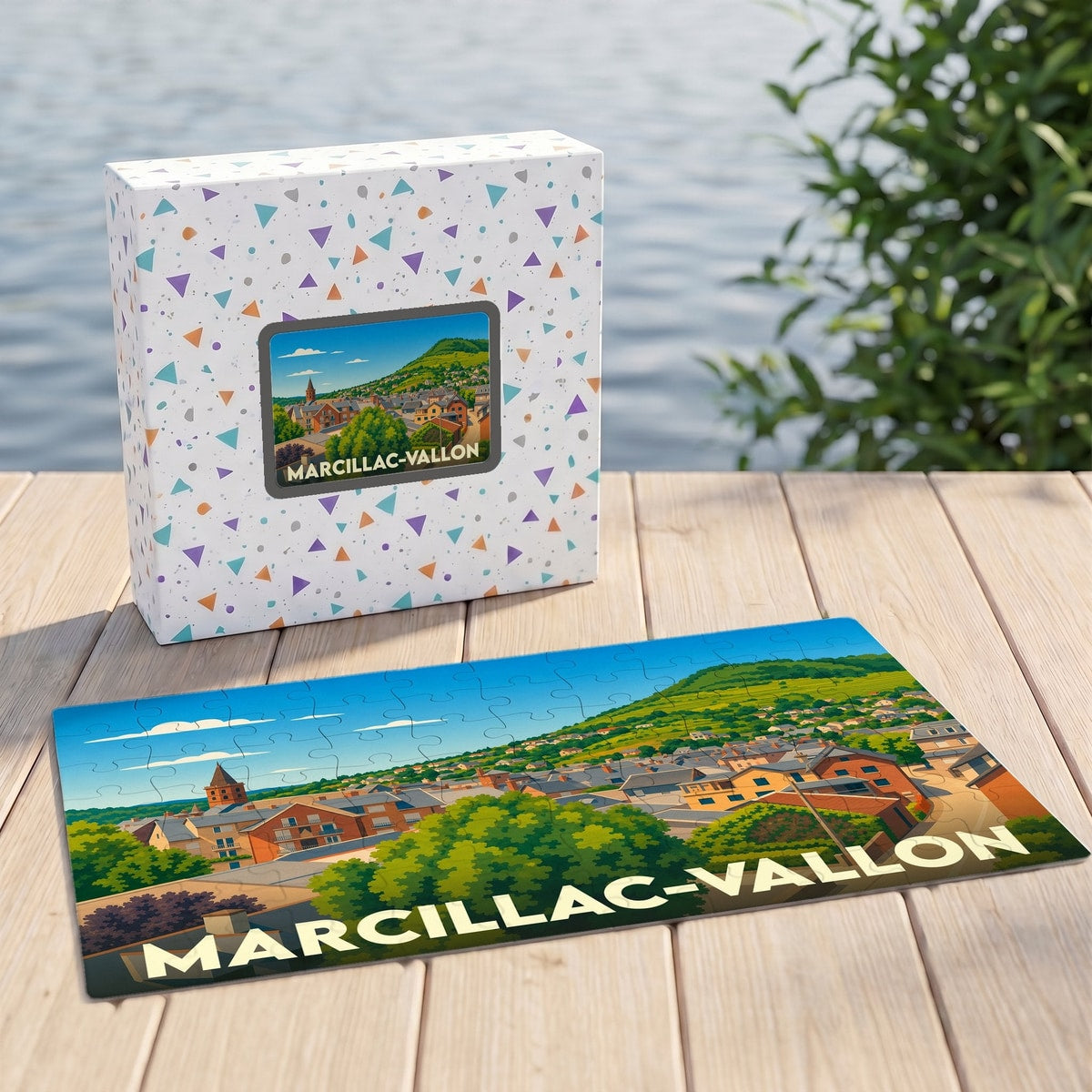 Puzzle souvenir de la ville de Marcillac-Vallon avec une illustration stylisée d'un village pittoresque.
