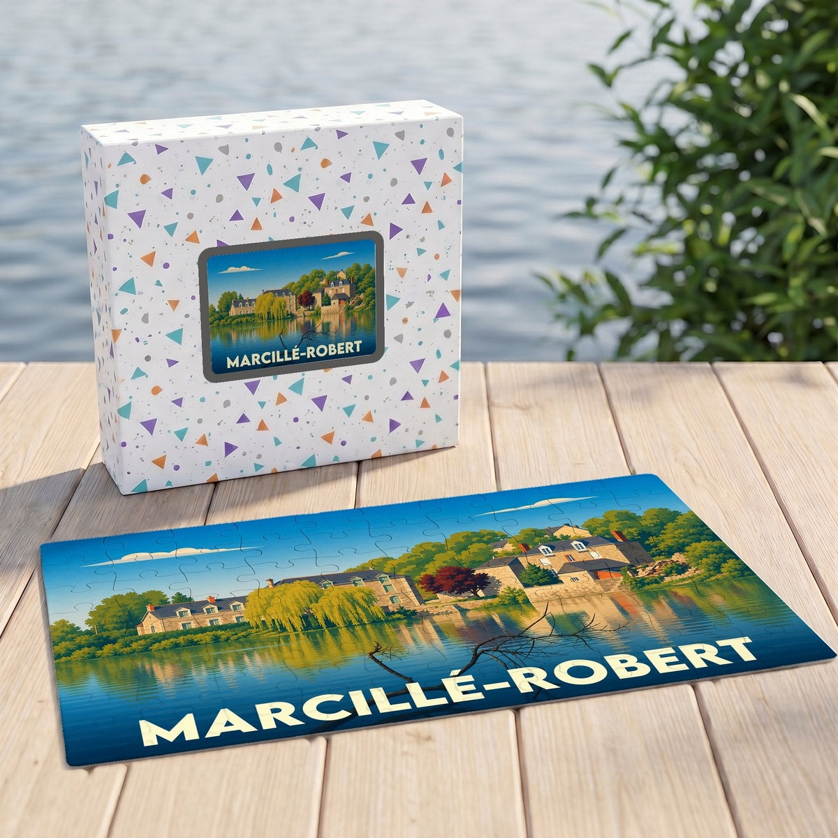 Puzzle souvenir de Marcillé-Robert représentant une illustration colorée du village au bord de l'eau.