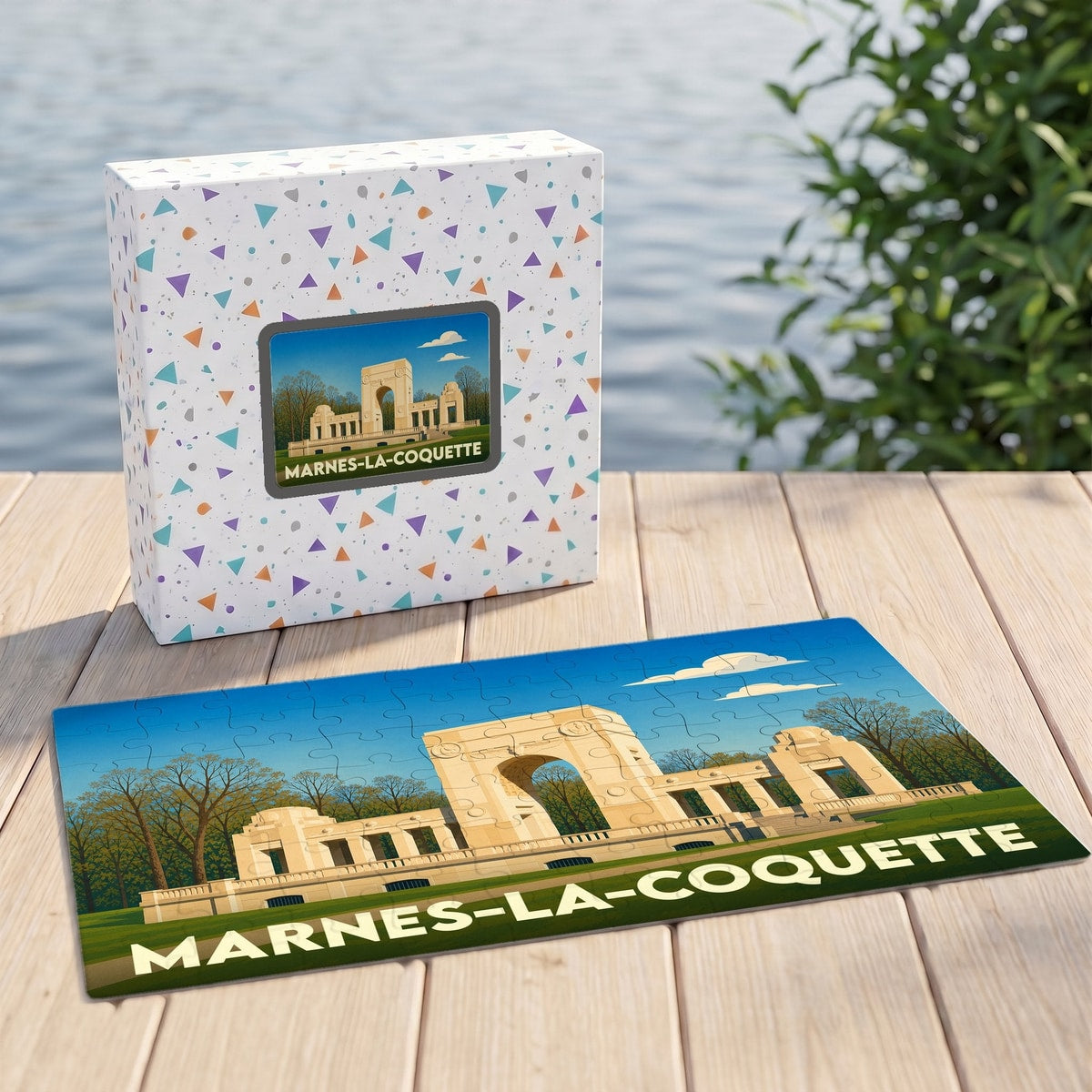 Puzzle souvenir de la ville de Marnes-la-Coquette avec son coffret assorti illustrant un monument historique de manière stylisée.