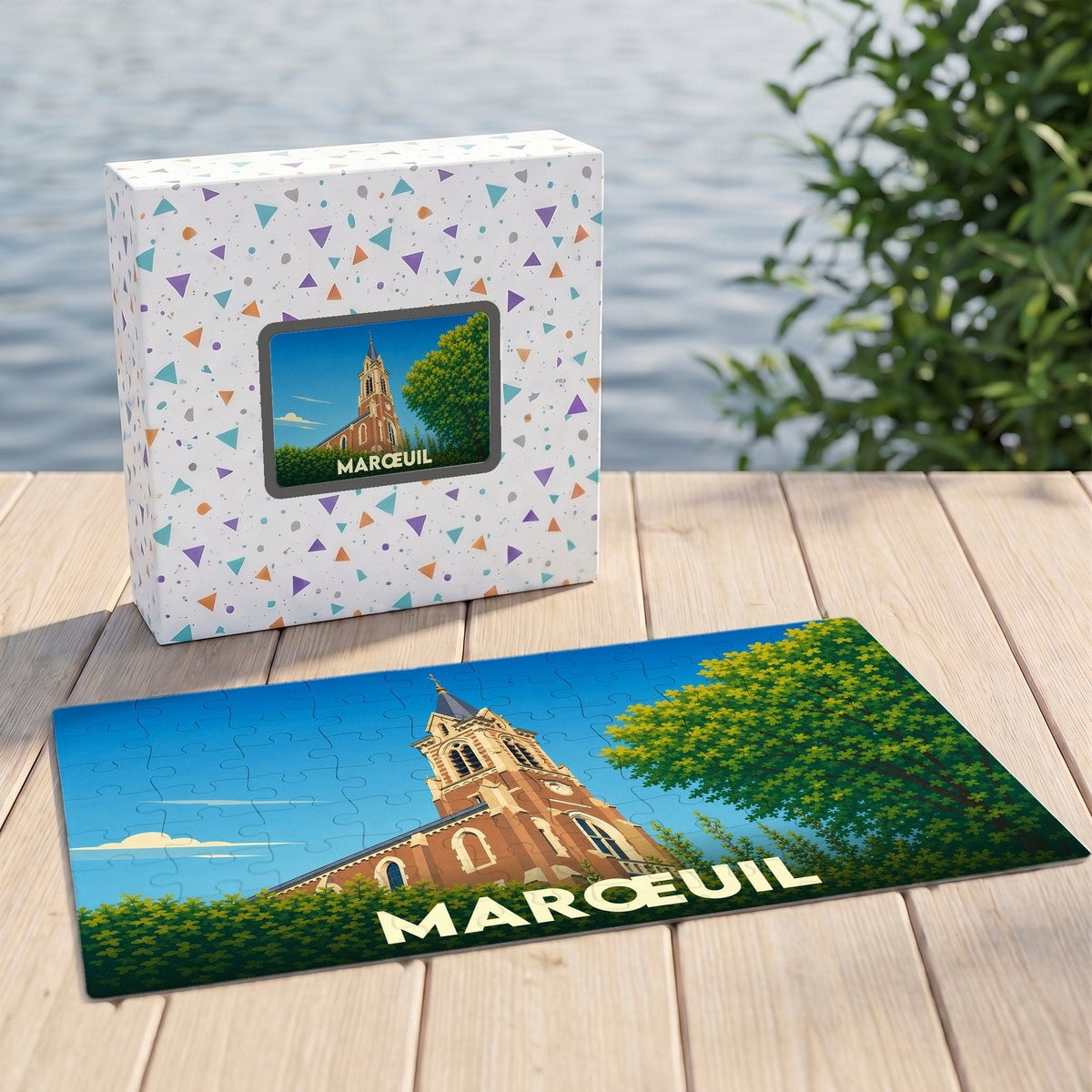 Puzzle souvenir de la ville de Marœuil avec une illustration stylisée d'une église sur sa boîte et son plateau.