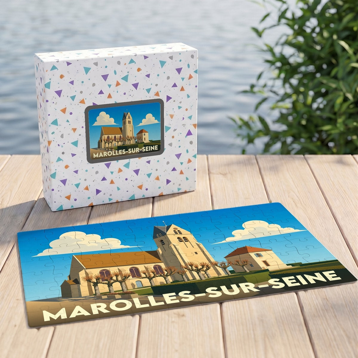 Puzzle souvenir de la ville de Marolles-sur-Seine avec son boîtier et une illustration stylisée de son église.