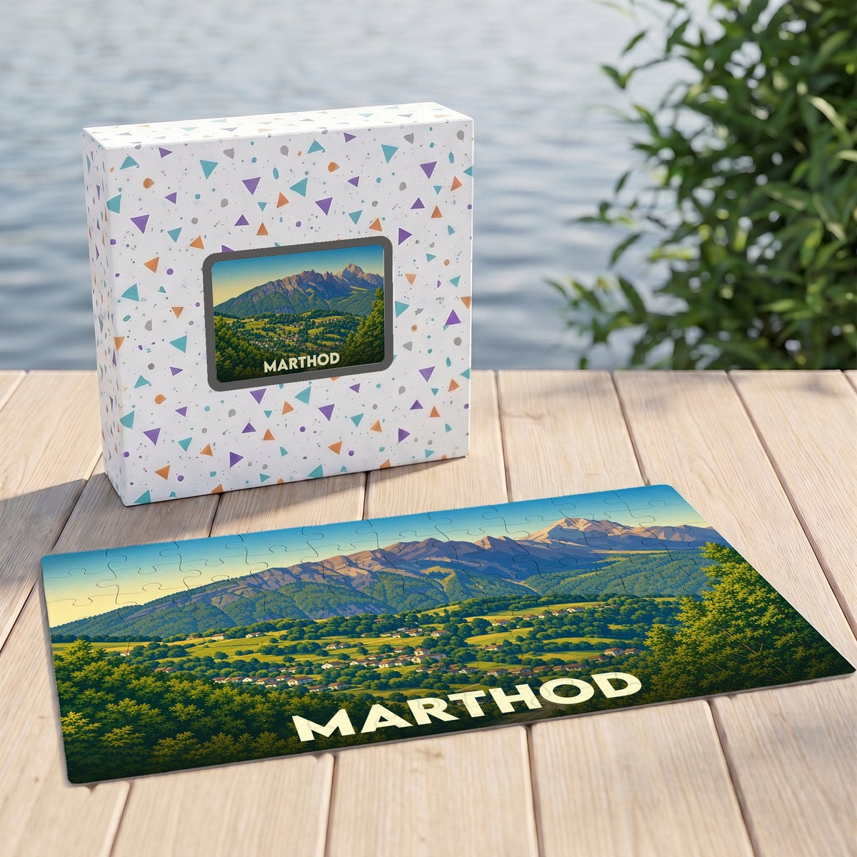 Puzzle souvenir de la ville de Marthod avec une illustration stylisée d'un paysage montagneux.