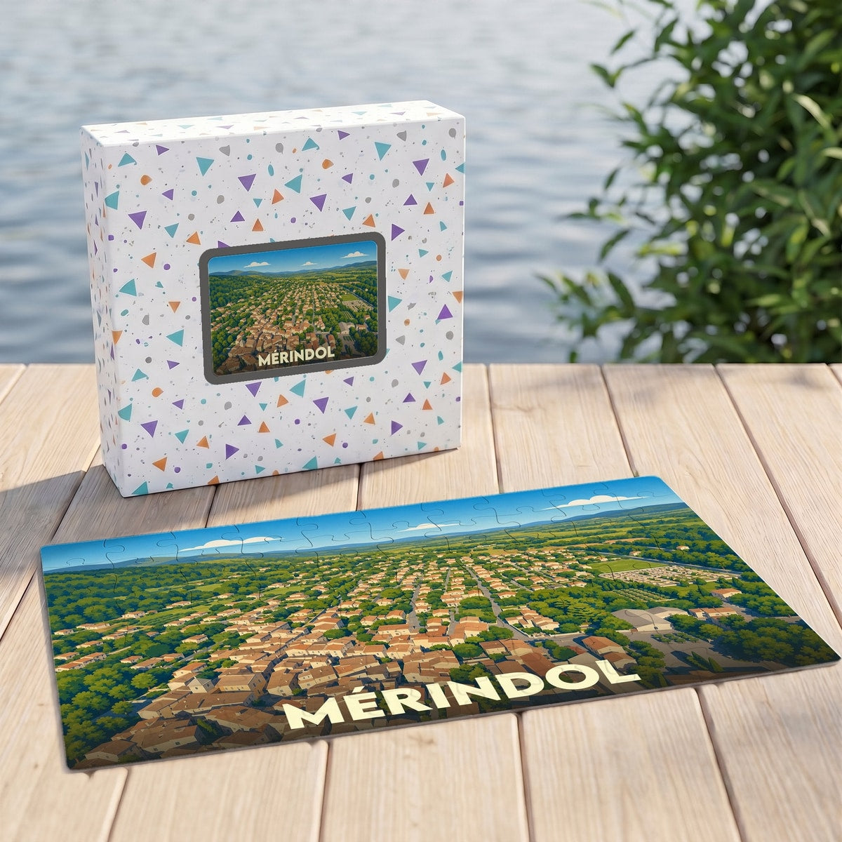 Puzzle souvenir de la ville de Mérindol illustré d'une vue aérienne stylisée.