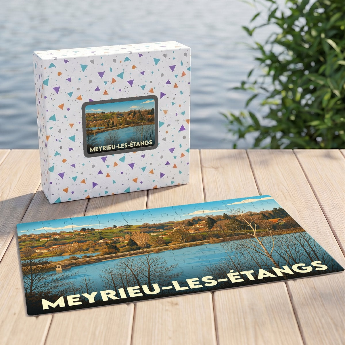 Puzzle souvenir de la ville de Meyrieu-les-Étangs avec une illustration de paysage lacustre.