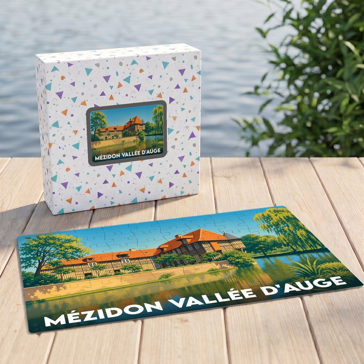 Puzzle souvenir de la ville de Mézidon Vallée d'Auge avec une illustration stylisée d'un manoir normand au bord de l'eau.