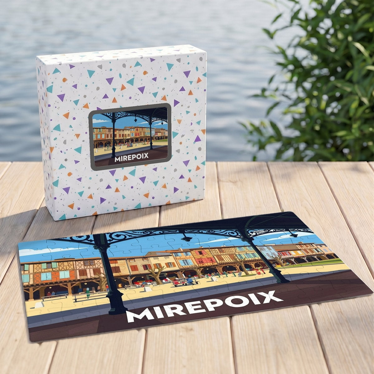 Puzzle souvenir de la ville de Mirepoix avec une illustration stylisée et sa boîte assortie.